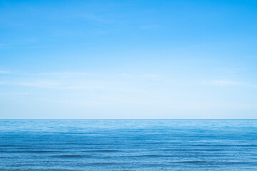 beautiful sea beach with small wave and clear blue sky. Summer holiday vacation background concept.