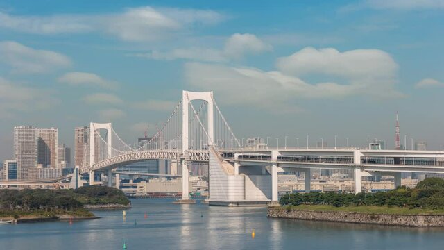 Tokyo Japan time lapse 4K, city skyline timelapse at Odaiba Rainbow Bridge and tokyo cityscape