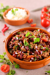 chili con carne- bean cooked with beef and spicy tomato sauce