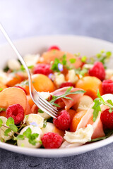 salad with melon, mozzarella and raspberry