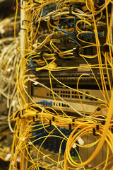 Close up of cables and wires connecting servers in data center or internet network, copy space