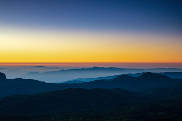 Beautiful sunrise at misty morning mountains
