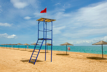 Lifeguard tower on the beach near the sea.