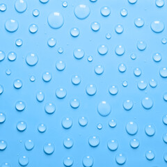 Water drops on blue background. Water texture close up. Backdrop glass covered with drops of water. Water bubbles.
