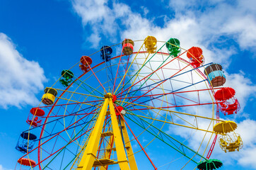 Ferris wheel in the park in summer.