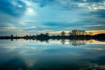 Evening blue clouds over a calm lake