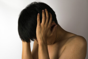 A person feeling a headache on a white background