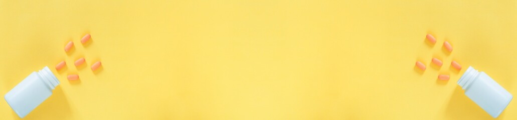 Pills and medicine bottles on a yellow background,All kinds of drugs to be put into the medicine bottle on the yellow background