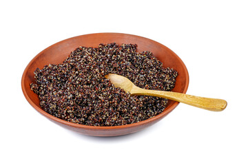 Cooked black quinoa in clay bowl with wooden spoon isolated on a white background
