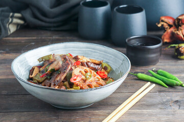 Lotus root or Rhizome stir-fry with Shiitake mushrooms, spices, hot peppers, dark soy sauce and green onions