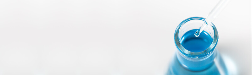 blue science test tube on white background,Pipette and chemistry dishes isolated on white background