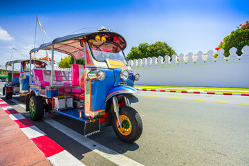 Blue Tuk Tuk, Thai traditional taxi in Bangkok Thailand,Bangkok traffic in front of Giant Swing 