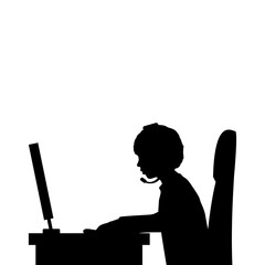 Silhouette boy sitting at the computer close up.