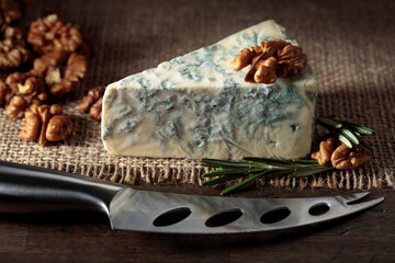 Fototapeta na wymiar Blue cheese with walnuts and rosemary.