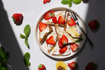 Healthy food breakfast strawberry toast with butter cream