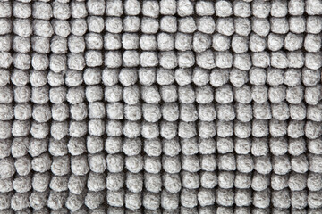 Gray chenille bath mat texture background