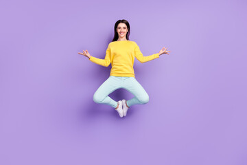 Fototapeta na wymiar Full length photo of positive happy relaxed woman jump up asana make om sign isolated on purple color background