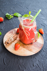 Healthy smoothie of fresh summer berries. Creative atmospheric decoration