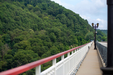 high bridge overlooking a beautiful green mountain valley, landscape