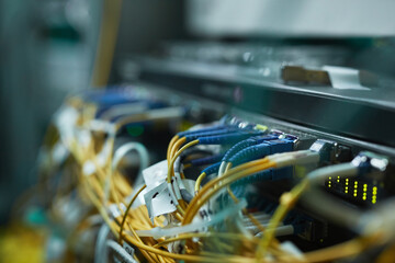Close up background image of blade servers in server cabinet at supercomputer or data center, copy...