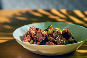 Grilled BBQ pork ribs with sesame seeds and peanuts. Chinese recipe and cuisine.