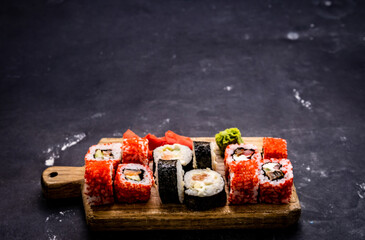 Sushi maki set. Japanese asian roll food composition with prepared rice and seafood following traditions © Ievgen Skrypko