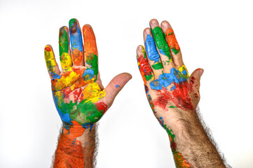 Hands painted in all colors against white background.