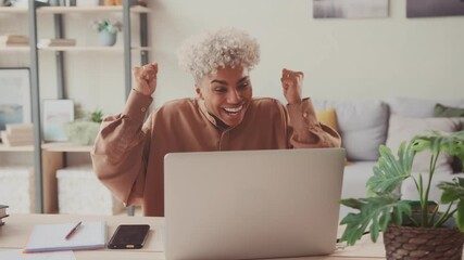 Excited happy African American woman feeling winner rejoicing online win got new job opportunity, overjoyed mixed race female student receive good test results on laptop celebrating admission.