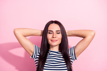 Fototapeta premium Portrait of attractive cheery dreamy woman resting holiday vacation isolated over pink pastel color background