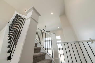House interior with a view of a staircase and window