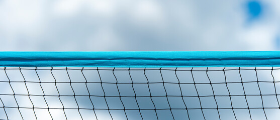 Beach volleyball and beach tennis net on sky background. Summer sport concept