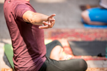 People exercising  yoga class outdoors 