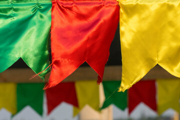 Multicolored flags made of fabric. Decoration for festivals and celebrations.