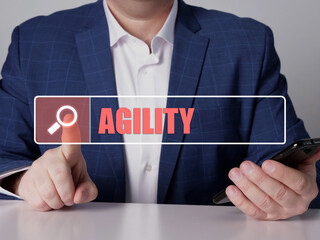  AGILITY text in search line. Budget analyst looking for something at smartphone. AGILITY concept.