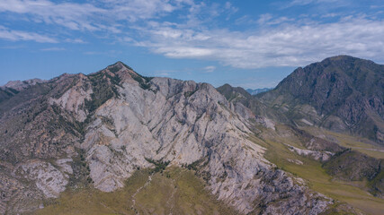 Aerial view of rocky mountains and green valleys with streams, Altai photo by drone