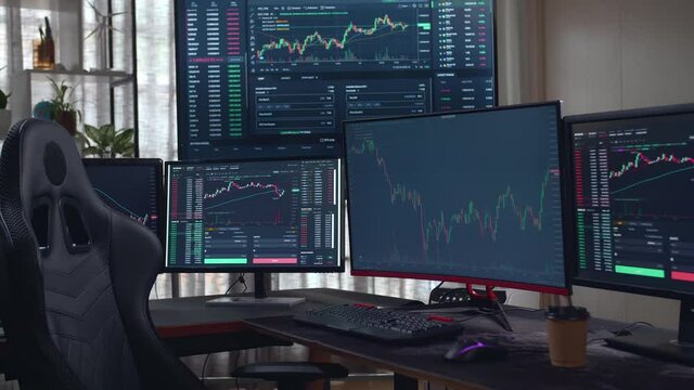 Stock Market Trader Multiple Computer Monitors With Financial Charts
