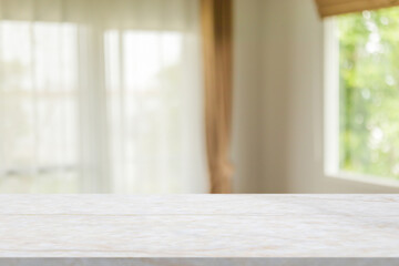 Marble table with blur room interior with window curtain background