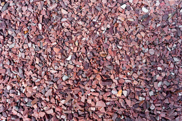 small red stones for background. Everything is covered with red rubble