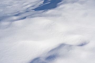 Pure white snow texture. Sparkling hills of snowflakes.