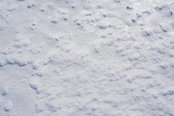 Pure white snow texture. Background from snowflakes top view.