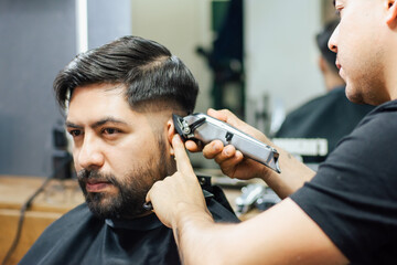 customer getting a haircut in barbershop