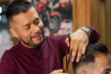 Hairdresser cutting hair with scissors