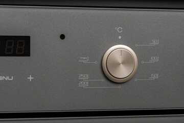 Modern oven mode control button close up