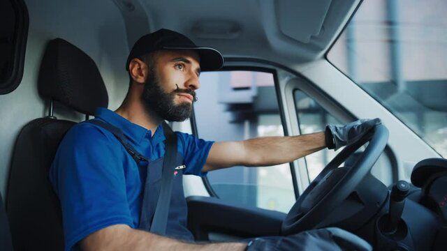 Portrait of Stylish Latin Delivery Truck Driver on the Road. Happy Professional Carefully Driving, Delivering Online Orders, E-Commerce Goods, Food, Medicine. Frontline Hero Doing Job. Inside Vehicle