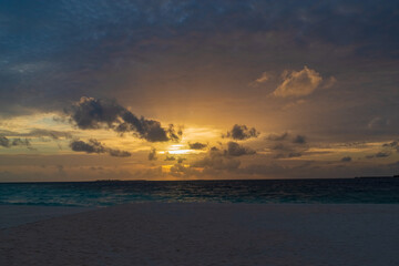 breathtaking view of the gorgeous sky at sunset from the pestled beach of the Maldives island