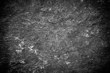 Fototapeta na wymiar Abstract background pattern of black stone slabs. pattern of large granite boulders