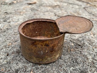 Rusty open tin can. An old iron can of canned food.