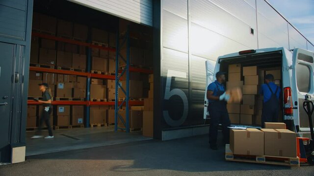 Time-Lapse in Outside of Retailer Warehouse: Manager Using Tablet Computer, Workers Loading Truck for Delivery. Cardboard Boxes, Online Orders, Medicine, Food Supply, E-Commerce Goods and Driving Away