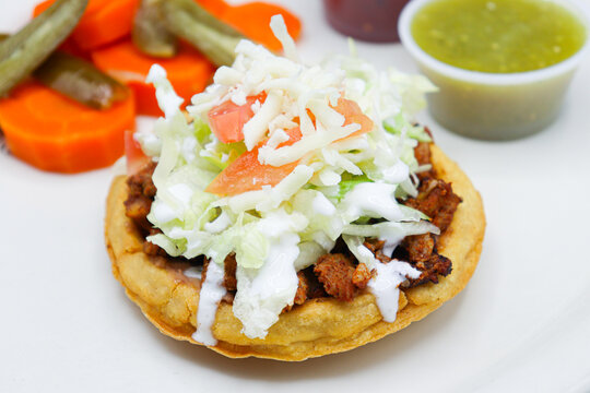 Ala Carte Sope with sour cream, cheese, and tomatoes