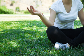 Young woman practicing yoga in the nature.